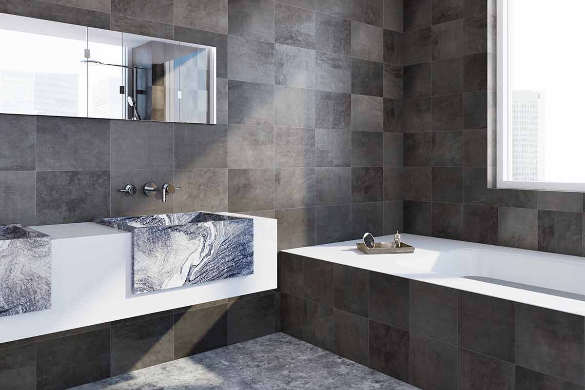 Black granite tiles and granite sink in modern home improvement bathroom project