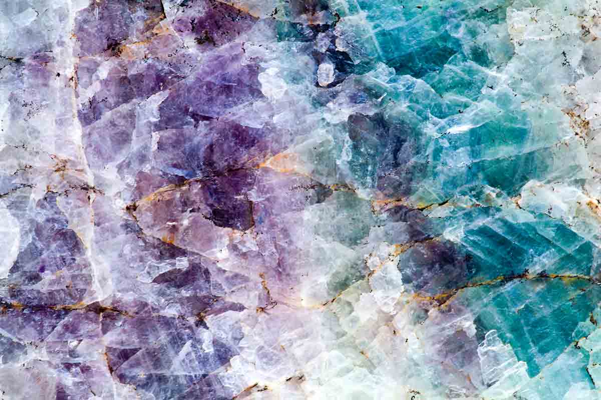 a close of image of a beautiful types of quartz with purple and blue hues.