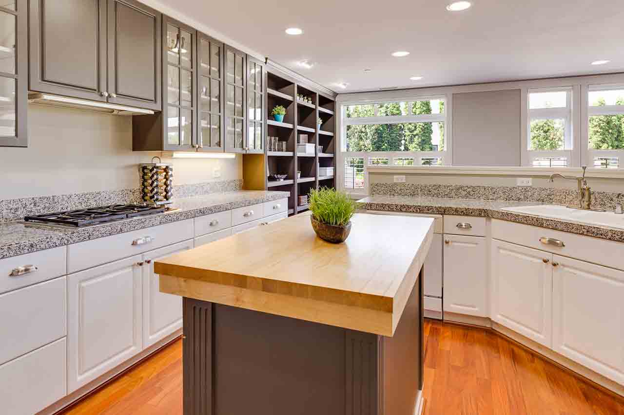 Picture of modern kitchen with granite countertops for the blog how to seal granite countertops.